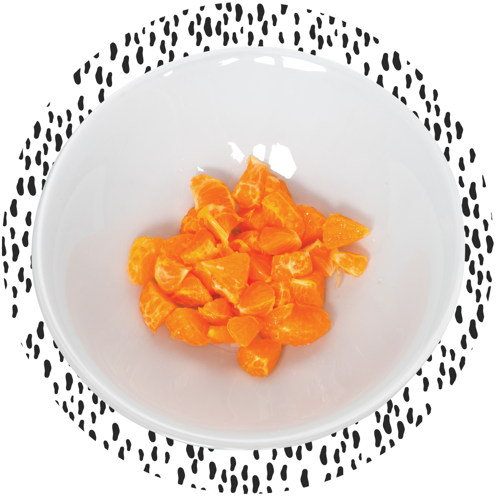 Bowl of vibrant orange mandarin slices on a white background.